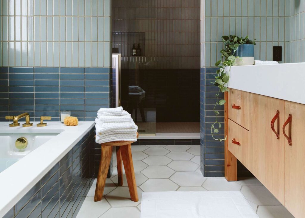 Bathroom with ceramic tile flooring and modern vanity in Toronto home