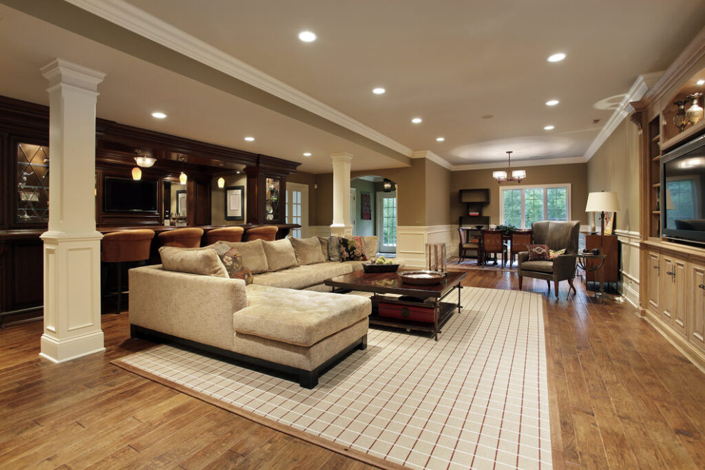Basement makeover showing brighter space after renovation.