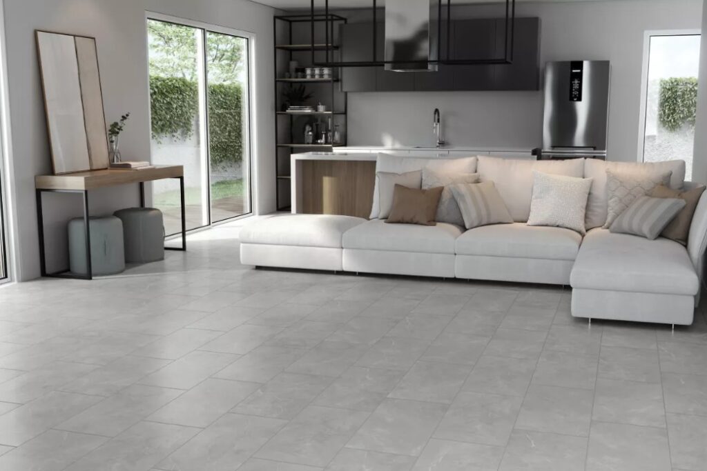 Living room with patterned ceramic tile flooring in neutral grey and white