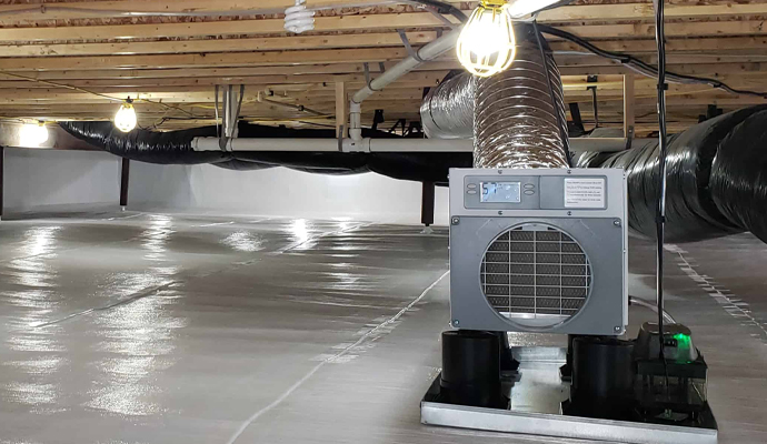 Dehumidifier in corner of finished basement.
