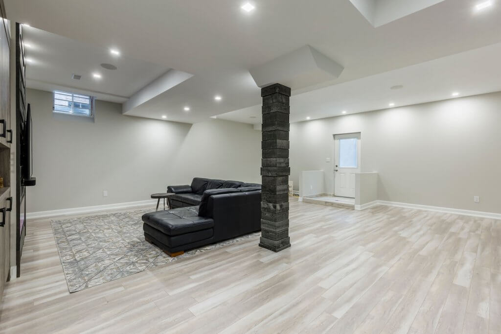 Basement renovation in Toronto with light grey laminate floor