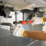 licensed plumber near me in toronto repairing kitchen sink